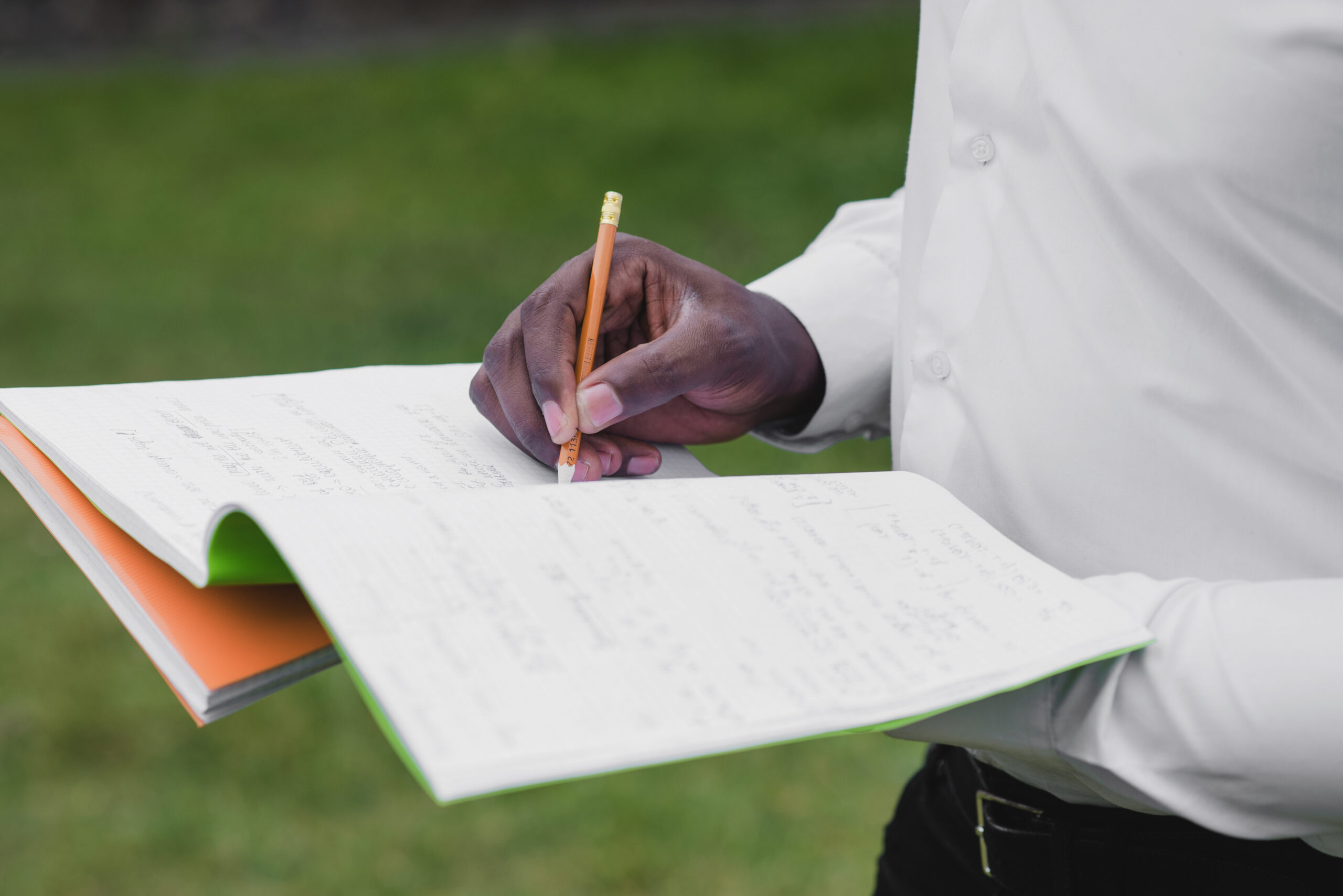 5 Things to Check Before Buying Land man holding notebooks writing